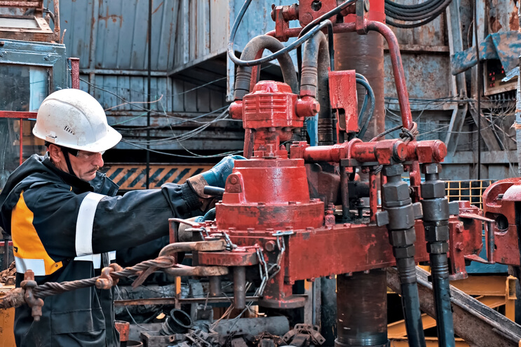 Man Using an Oil Driller 