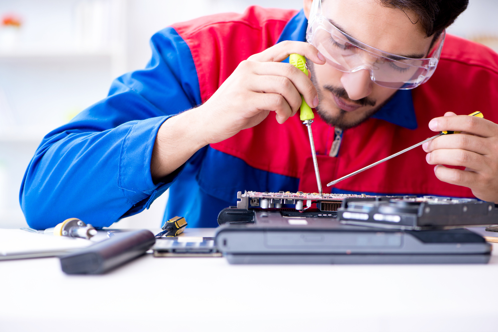 Repairman Fixing Computer Laptop